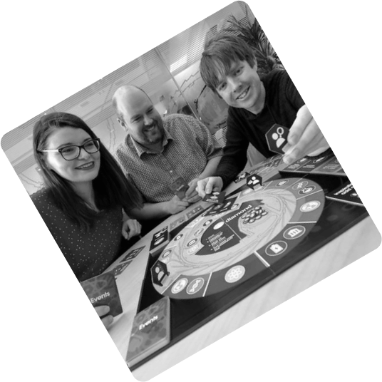 Matthew demonstrating one of his board games